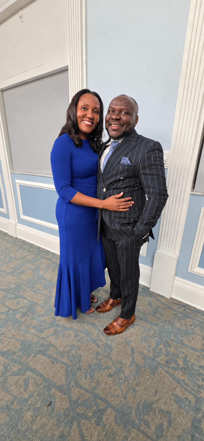 The pastor and his wife smiling together